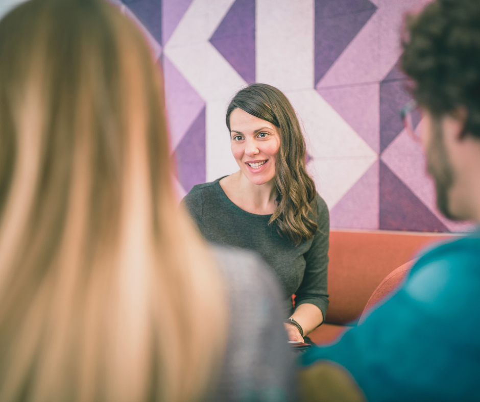 Close up of a female counsellor speaking with a couple in couples therapy