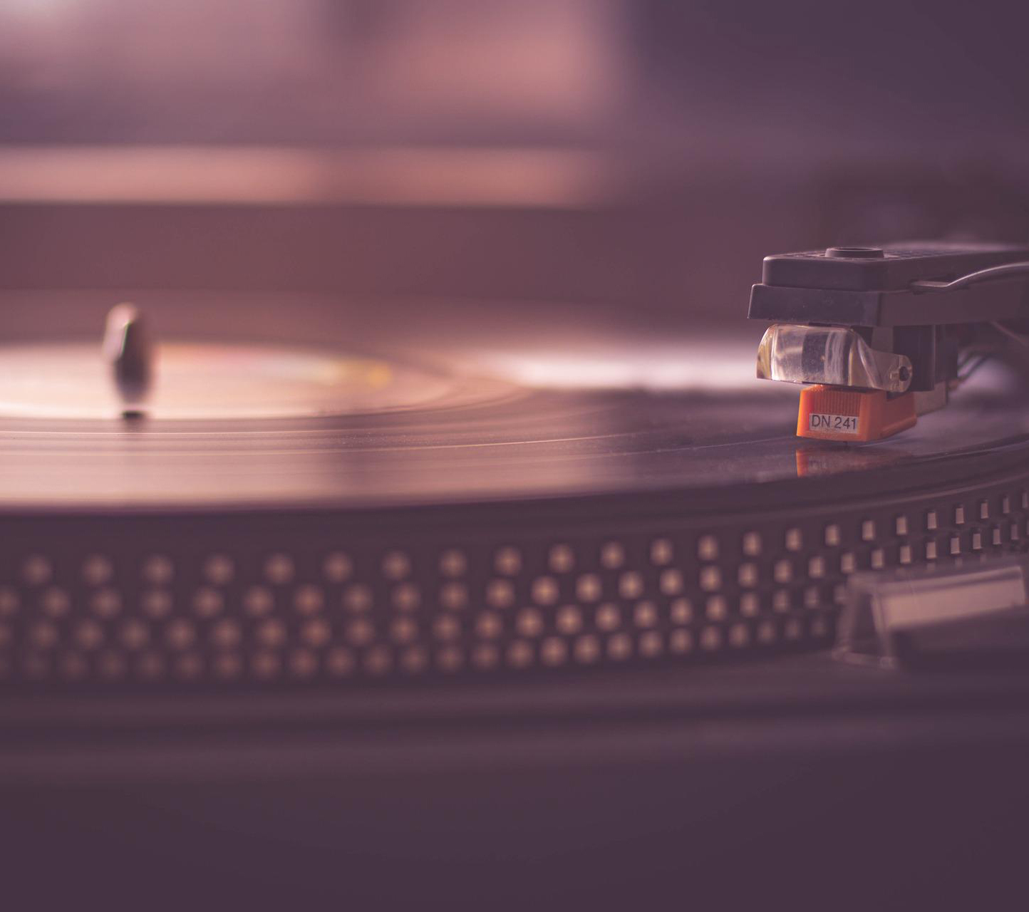 Close up of a vinyl record playing on a turntable