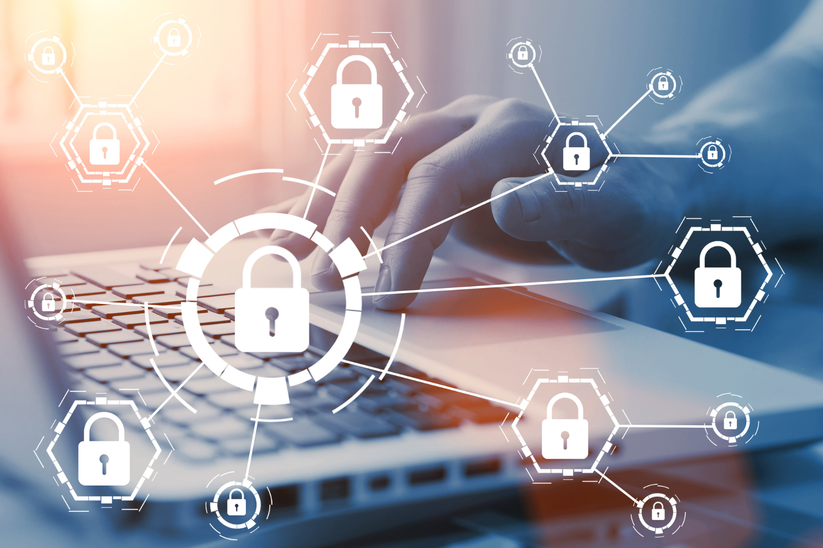 Close up of man working on a laptop with white padlock icons overlaid to symbolise the importance of online data security in a home counselling business.