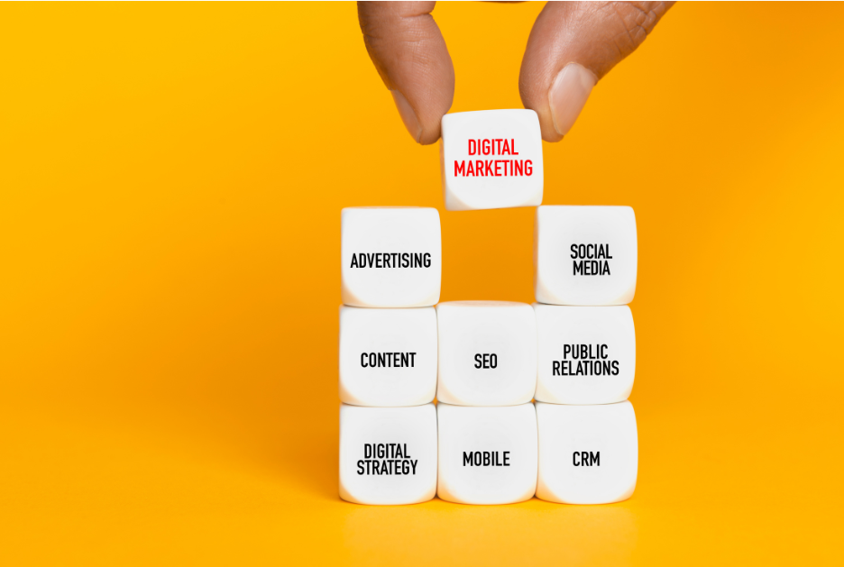 White dice with marketing terms written on them in black against a yellow background