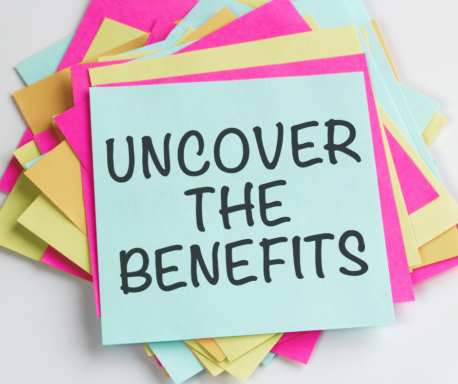 Pile of post it notes with top note saying "uncover the benefits"