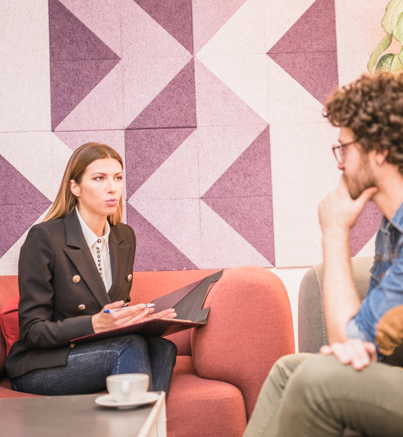 Female counsellor talking to a male counselling client