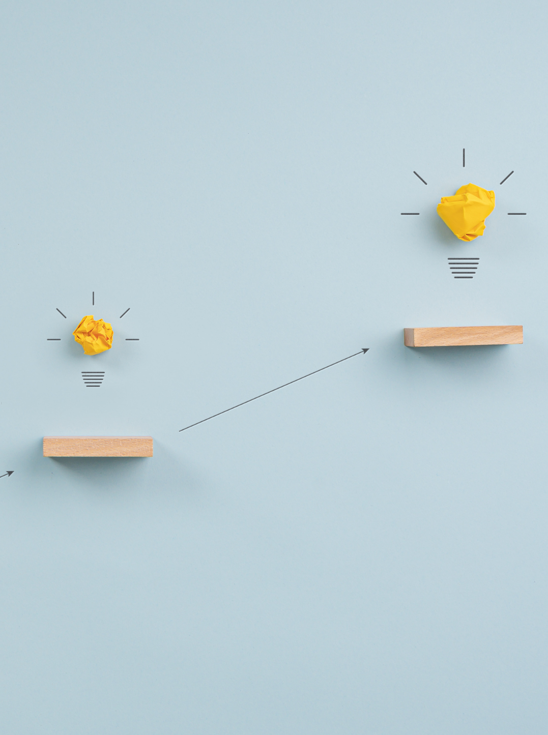 Image showing two yellow lightbulb images. Illustrating moving upwards towards brighter ideas.