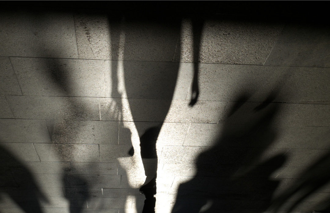 Shadows against a concrete floor