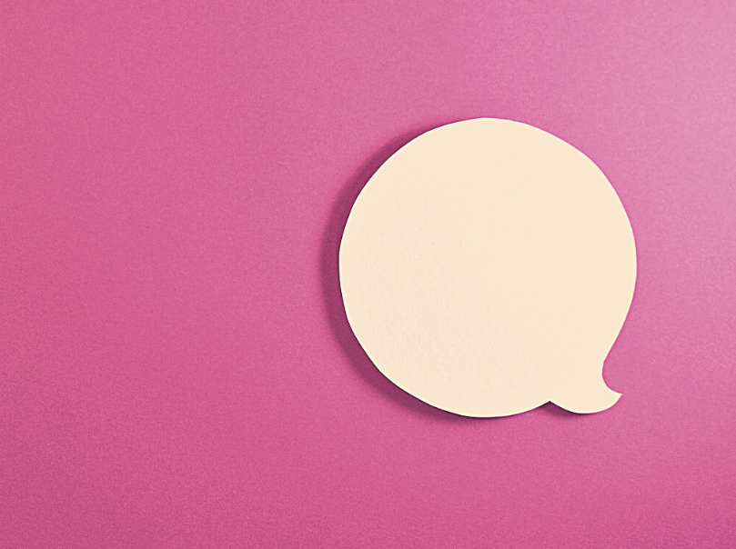 White speech bubble against a pink background