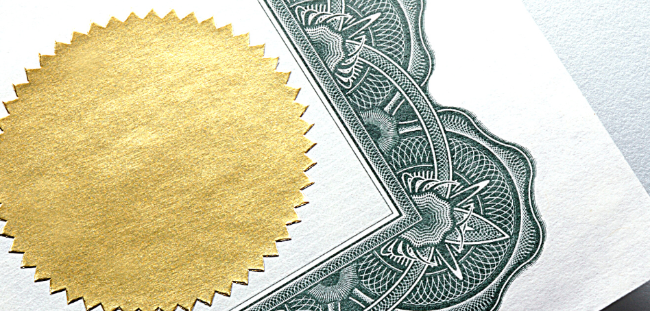 Close up of a counselling qualification certificate with a gold stamp.