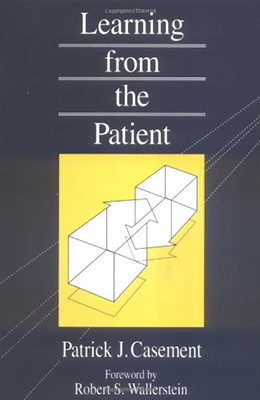 Photo of office chair and desk in blue form the book cover for On learning from the patient by Patrick Casement.